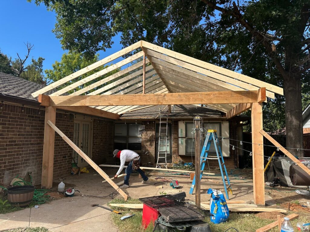 Gable roof patio cover wood framing under construction in North Texas